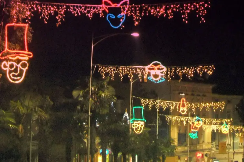 Carnival mask lights over a street in Opatija