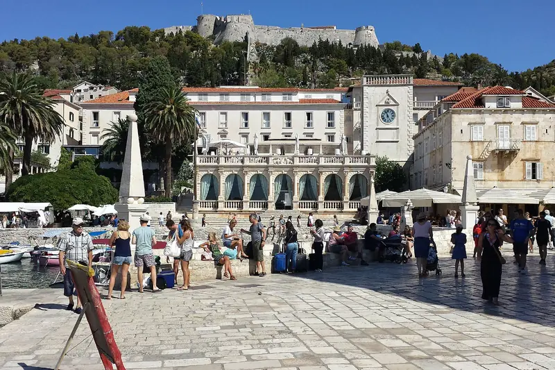 St. Stephen's Square in Hvar town, with the fortress above